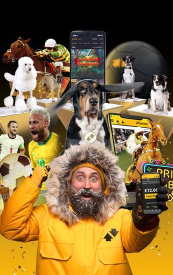 a man holding a phone and a dog