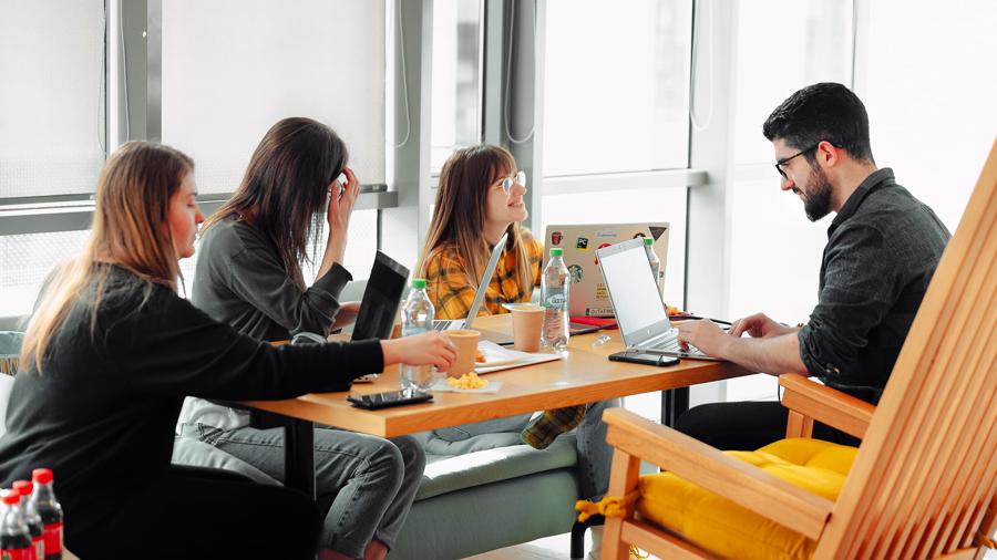 a group of people sitting at a table