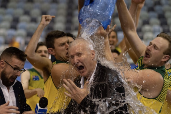 a man pouring water into a man's head